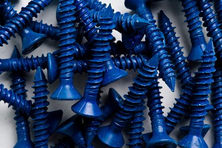 Blue screws on a white backgroundの写真素材