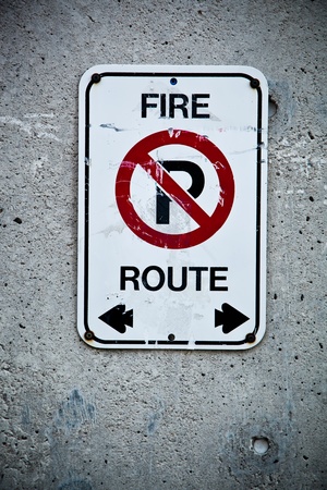 Fire route sign on a concrete wallの写真素材