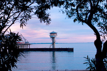 Lighthouse in the evening on the pierの写真素材
