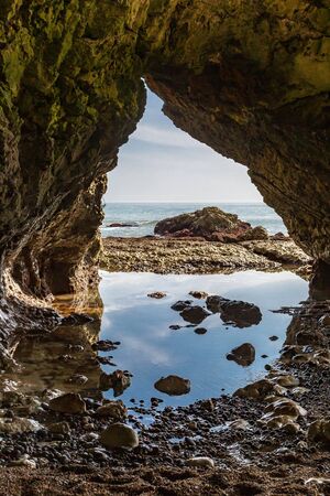Looking out to sea from a cave at Freshwater Bay on the Isle of Wightの写真素材