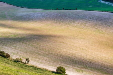 Looking down on farmland in the South Downs, on a late summers dayの写真素材