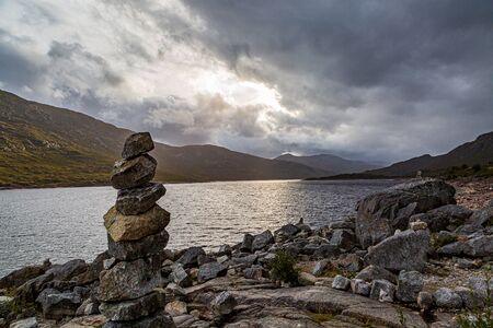 Zen rocks on the shore of Loch Cluanie in Scotlandの写真素材