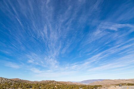 A remote road in the Nevada desert, with a vast sky overheadの写真素材