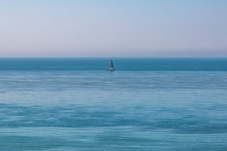 A Sailing Boat on a Calm Ocean on a Sunny Day