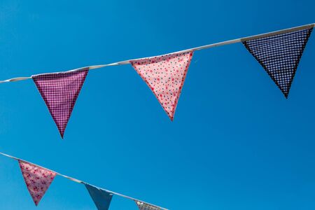 Pretty bunting against a clear blue skyの写真素材