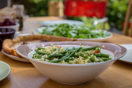 An outdoor dining table set for a summer lunchの写真素材
