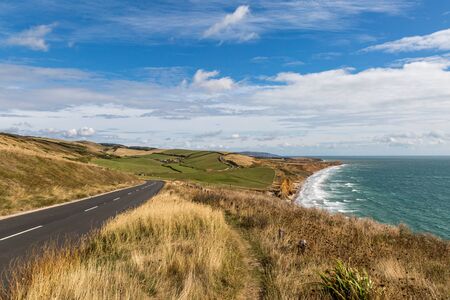 Looking along the coastline of the Isle of Wight towards Compton Bay, with The Military Road running alongside the coastal pathの写真素材