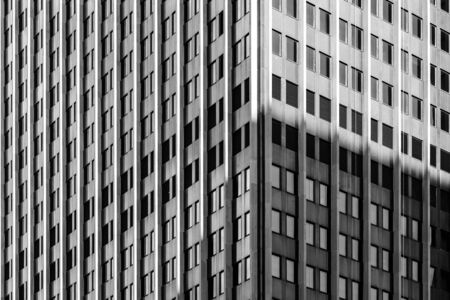 A full frame photograph looking at the exterior of a city skyscraperの写真素材