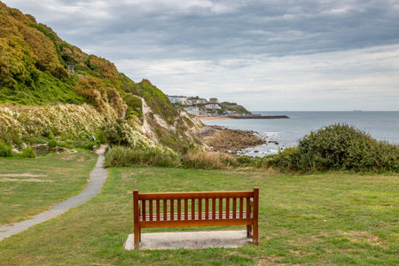 A bench with a view over the seaside town of Ventnor, on the Isle of Wightの写真素材