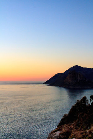 The rugged coastline of the Cape Peninsula in South Africa, at sunset