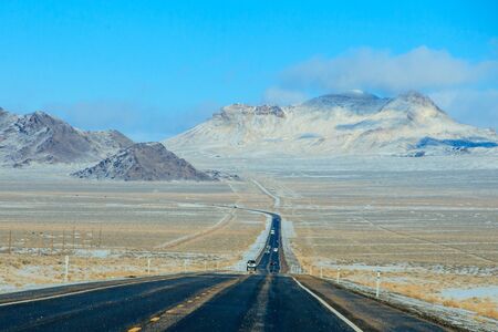 Looking along a long road in Nevada, in Winterの写真素材