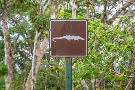 A sign warning of crocodiles, in the Costa Rican countrysideの写真素材