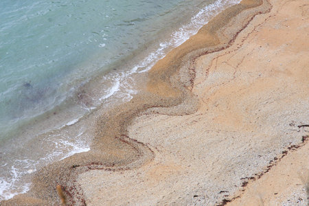 A high angle view of wave patterns on a beach