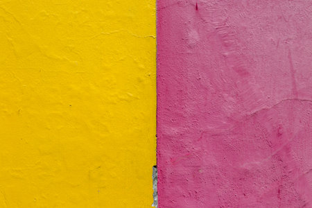 A bright yellow and pink painted wall