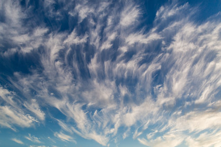 Wispy clouds and a blue sky