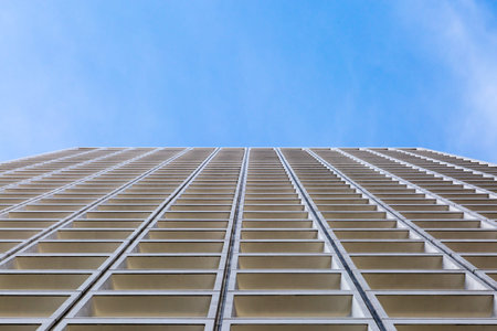 Looking up at a building and a blue sky