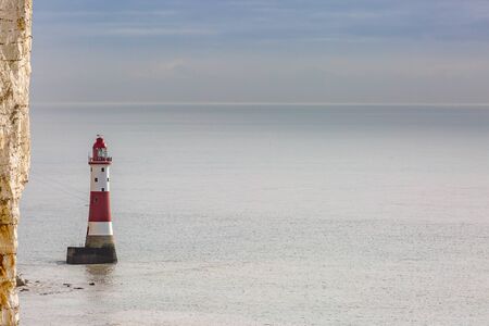Chalk cliffs and Beachy Head lighthouse off the Sussex coastの写真素材