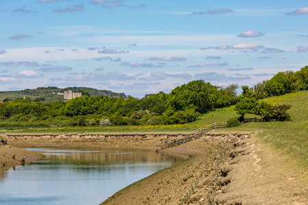 Looking along the River Ouse in Sussex with Lewes castle in the distanceのeditorial素材