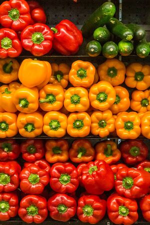 Vibrant peppers for sale on a market stallの写真素材