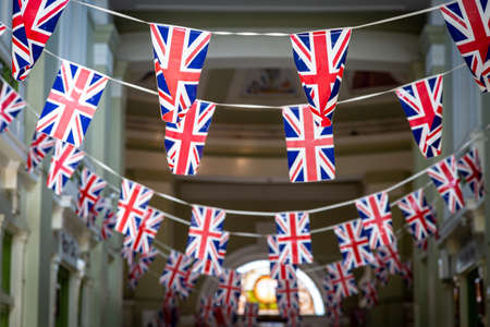 Union Jack bunting hanging in an arcadeの写真素材