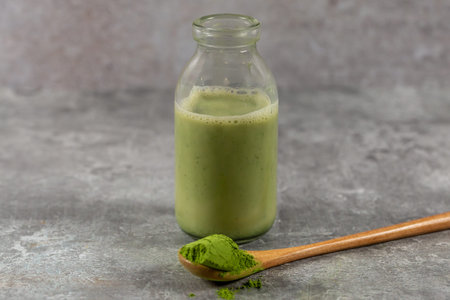 Vibrant matcha powder and a matcha latte