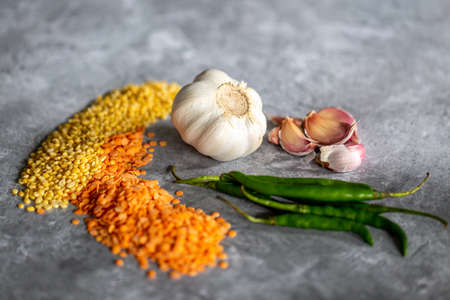 Garlic chilli and lentils against a grey backgroundの写真素材