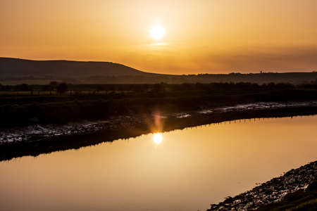 Sunset over the River Ouse near Lewes, in Sussexの写真素材