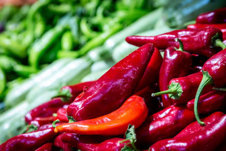 Red chillies for sale on a market stall, with a shallow depth of fieldの写真素材