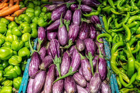Vibrant vegetables for sale on a market stallの写真素材