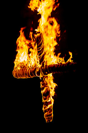 A burning cross at Lewes bonfire night representing one of the Protestant martyrs who was burnt at the stake in the town in the 16th centuryの写真素材