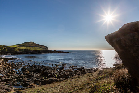 Looking towards Cape Cornwall from Porth Ledden Beach, on a sunny summer's eveningの写真素材