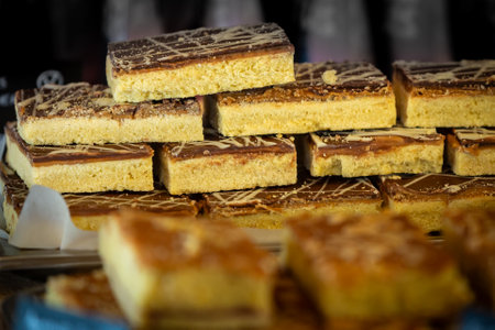 A cake stand display with delicious caramel and chocolate shortbread, with a shallow depth of fieldの写真素材