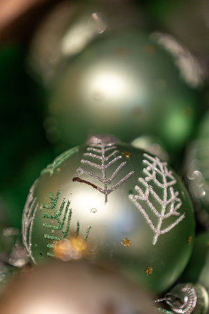 Decorative Christmas baubles for sale on a market stall, with a shallow depth of fieldの写真素材