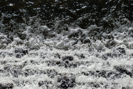 A high angle view of water crashing down rocks