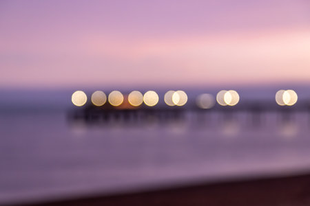 An atmosperic defocused photograph over the sea at sunsetの写真素材