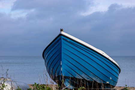 A boat moored on the beach at Deal in Kent, with a shallow depth of field