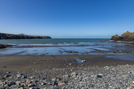 Looking out over the ocean at Abereiddy Beach in Pembrokeshire, on a sunny March dayの写真素材