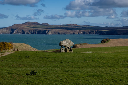 The Pembrokeshire coast on a sunny day, with Carreg Samson monument in the foregroundの写真素材