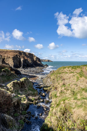 A view out to sea from Aberfelin beach near Trefin in Pembrokeshire, on a sunny March dayの写真素材