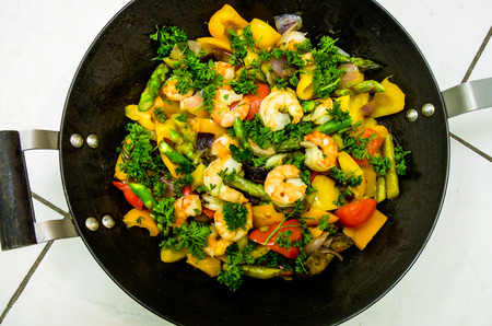 Colorful shrimp dish cooked in a wok の写真素材