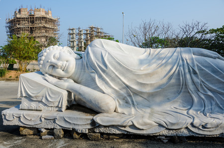 Large marble statue of the reclining Buddha at Linh Ung Pagoda is one of many statues celebrating Buddhism is the symbol of the rise of Buddhism in Vietnam in the 21st century.のeditorial素材
