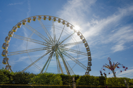Paris, France, August 10, 2015 - Tuileries Gardens, with its Ferris wheel and other rides, is a popular destination in the summer with tourists as well as local families.のeditorial素材