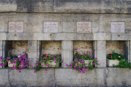 Paris, France, August 17, 2015 - : Memorial plaques placed along Rue de Rivoli beside Tuileries Gardens honor soldiers who were killed on August 25, 1944, the day France was liberated from the Germans.のeditorial素材