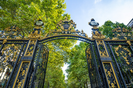 Paris, France, August 28, 2015 - The ornate gate leads to Monceau Park, created as a public park in 1776, containing numerous statues and reconstructions including a Roman colonnade.のeditorial素材