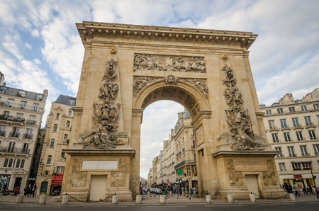 Paris, France, September 3, 2015 - Porte Saint-Denis is a triumphal arch built in 1672 replacing a medieval gates of the Wall of Charles V. The Latin inscription reads "To Louis the Great".のeditorial素材