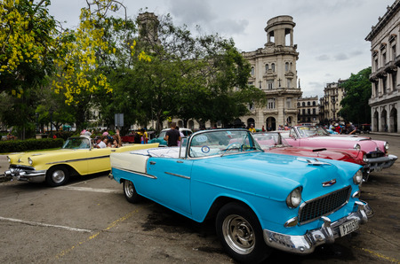HAVANA - CUBA,  JUNE 9, 2016: Colorful classic convertible cars popular with tourists are parked near the Museum of Fine Arts in La Habana Vieja waiting for passengers.のeditorial素材