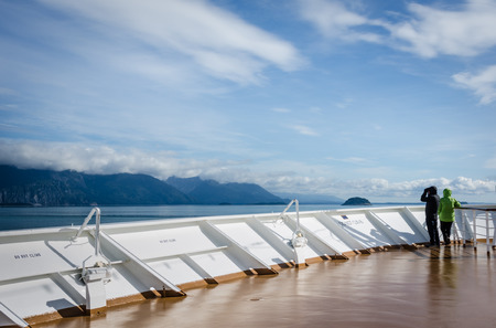 Glacier Bay, United States, September 11, 2016 - Cruise ship passengers look out for marine life while sailing in Glacier Bay National Park and Preserve in Southeast Alaska.のeditorial素材