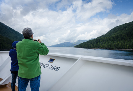 Glacier Bay, United States, September 11, 2016 - Cruise ship passengers look out for marine life while sailing in Glacier Bay National Park and Preserve in Southeast Alaska.のeditorial素材
