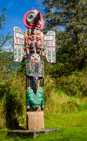 Ketchikan, Alaska, September 12, 2016 - The totem poles in the Saxman Native Village is the largest collection of Native American standing totem poles.のeditorial素材