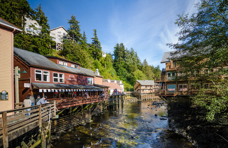 Ketchikan, Alaska, September 12, 2016 - Creek Street is a historic boardwalk perched on pilings along the banks of Ketchikan Creek and infamous for being the cityâs red light district. Today, the buildings house a variety of shops popular with tourists.のeditorial素材
